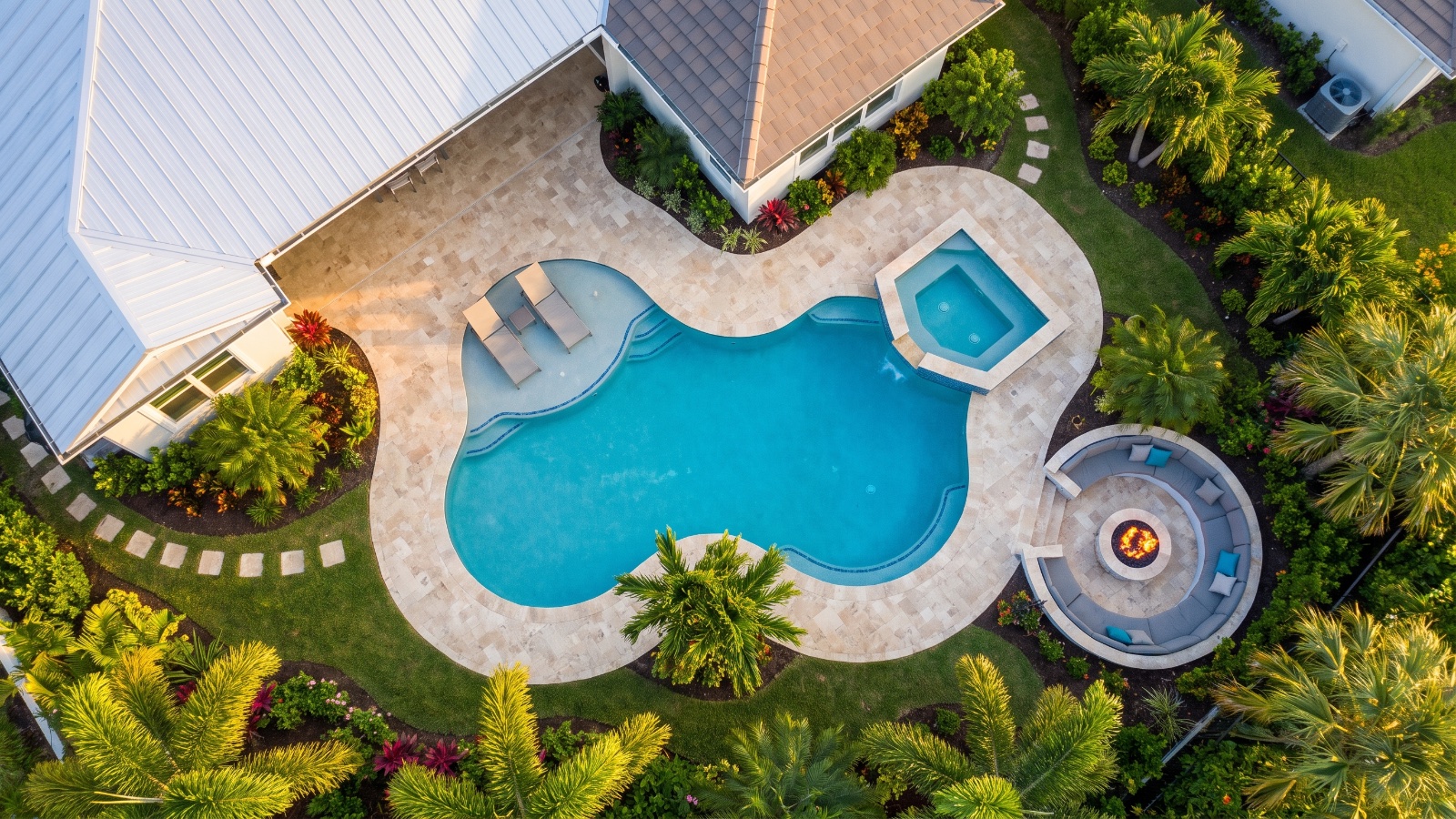 Completed custom gunite pool with travertine deck